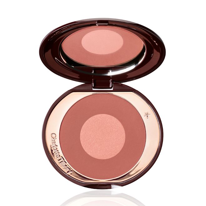 Cheek to Chic in Pillow Talk Intense open An open, mirrored lid, two-tone powder blush in berry pink and rose gold shades.