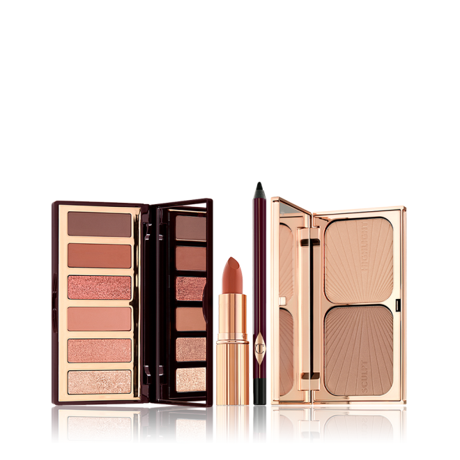 An open, 6-pan eyeshadow palette, black eyeliner pencil, open lipstick, and a duo contour palette with a mirrored lid in sleek, gold-coloured packaging.