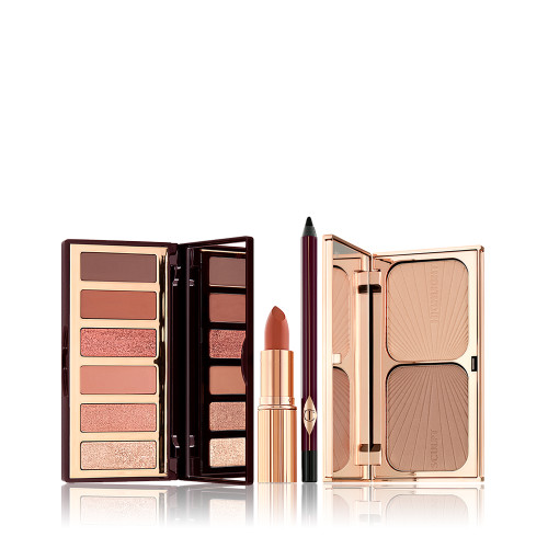 An open, 6-pan eyeshadow palette, black eyeliner pencil, open lipstick, and a duo contour palette with a mirrored lid in sleek, gold-coloured packaging.