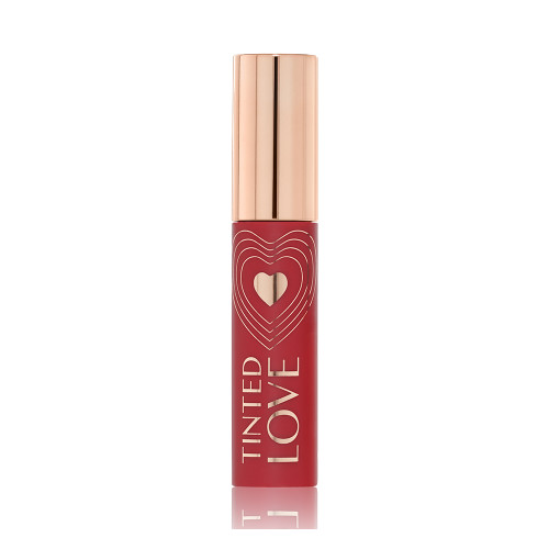 A closed lip and cheek tint with a gold-coloured lid in a vibrant-red-coloured tube. 