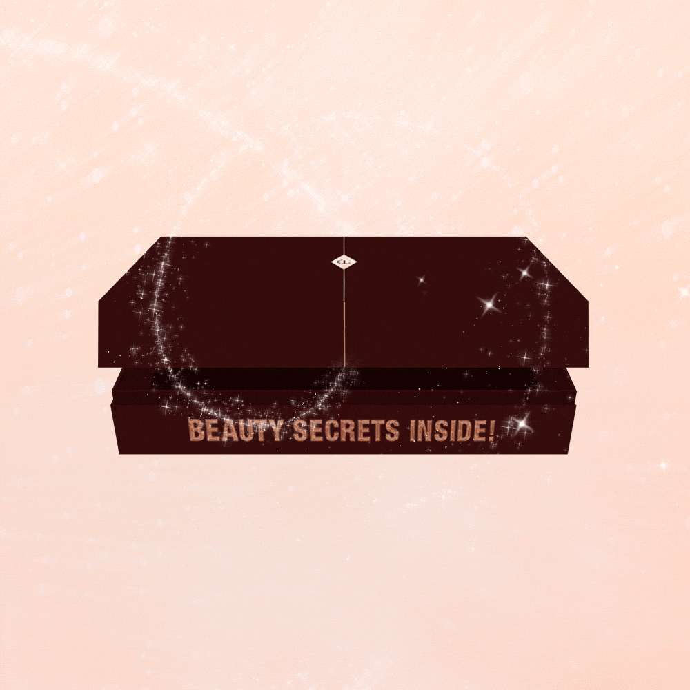 A GIF of a dark brown mystery gift box with text on it that reads, 'Beauty Secrets Inside!'