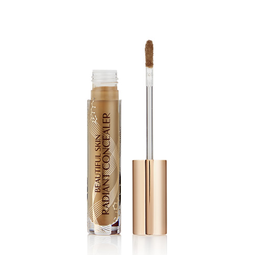 caramel brown radiant concealer in a glass tube with its gold-coloured lid with a doe-foot end next to it, and text on the tube that reads, 'Beautiful Skin Concealer'