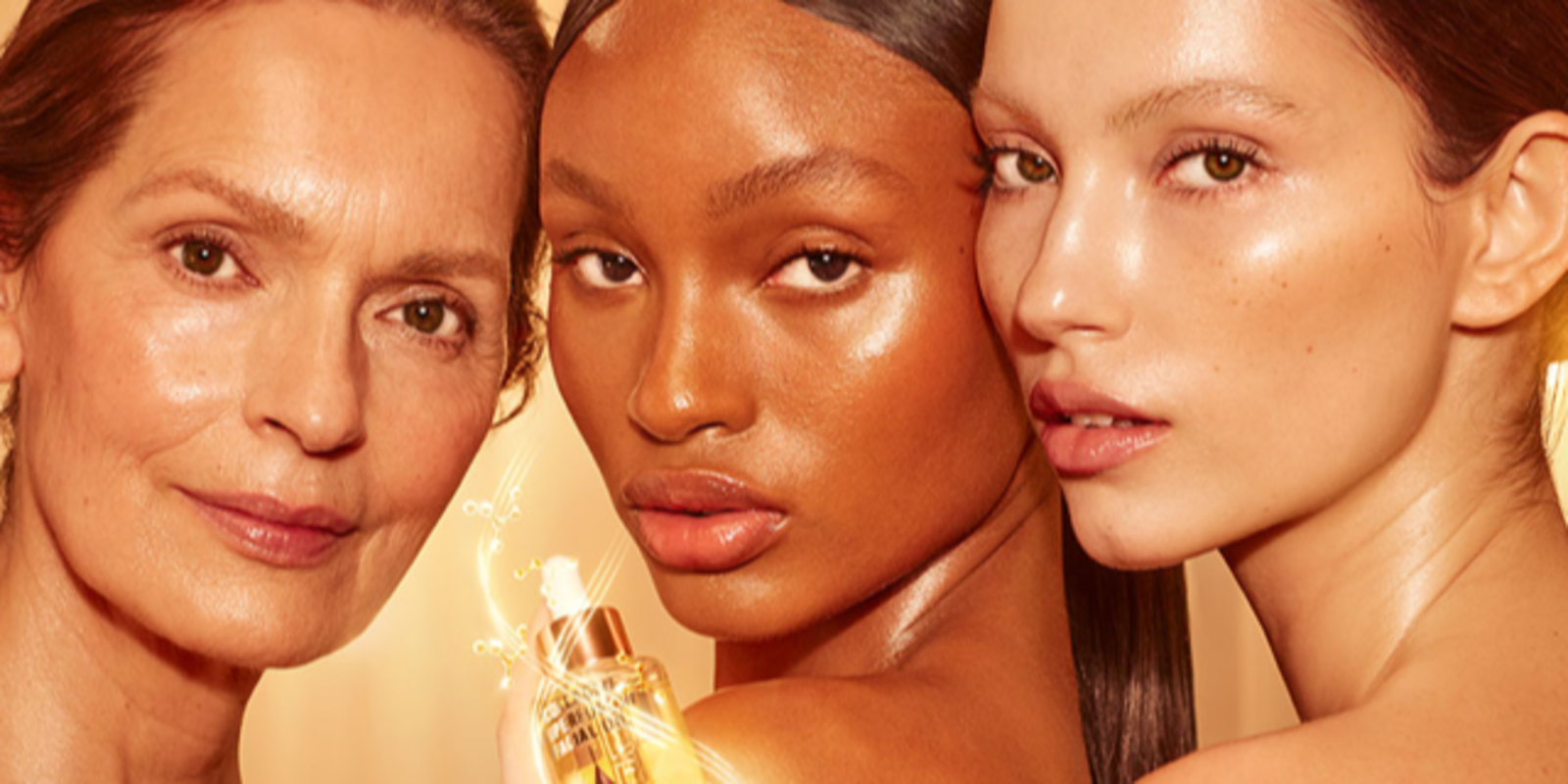 Light, tan, and deep-tone models with glowy, luminous, glass skin, holding up a light-gold-coloured facial oil in a glass bottle with a gold and white-coloured dropper lid.