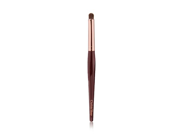 An eyeshadow smudging brush in a rose gold and dark crimson colour scheme. 