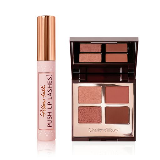 Mascara in pink and gold packaging with a quad eyeshadow palette with matte eyeshadows in shades of brown. 