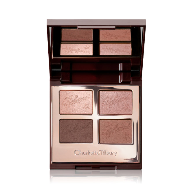 An open, mirrored-lid quad eyeshadow palette with shimmery and matte eyeshadows in pink champagne, metallic blush pink, mink brown and antiqued brown colours.