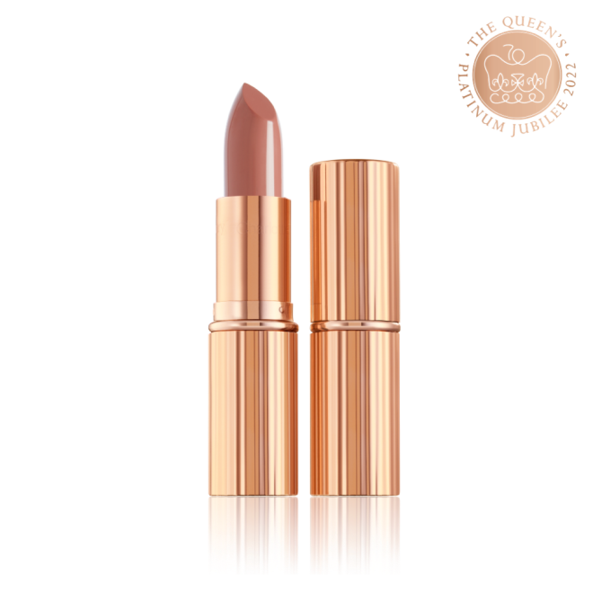 two lipsticks, with and without lid, in soft rosy peach shade with a satin finish in sleek gold-coloured packaging.