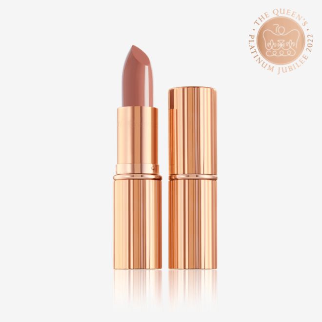 K.I.S.S.I.N.G. in Runway Royalty with and without lid two lipsticks, with and without lid, in soft rosy peach shade with a satin finish in sleek gold-coloured packaging.