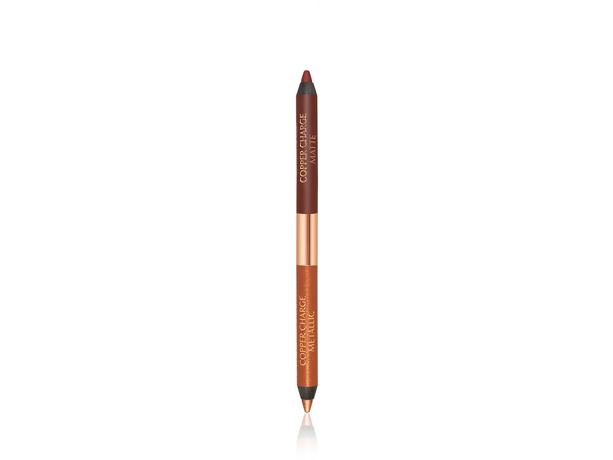 Two-sided eyeliner opened with the top half being a matte warm russet colour and the bottom half being a metallic copper colour.
