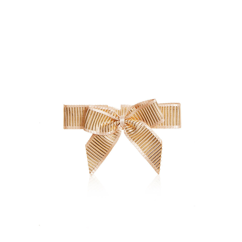 A shiny champagne-coloured ribbon tied in an elegant bow.