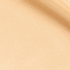 Swatch of a glowy, luminous primer in a light yellow-beige shade.