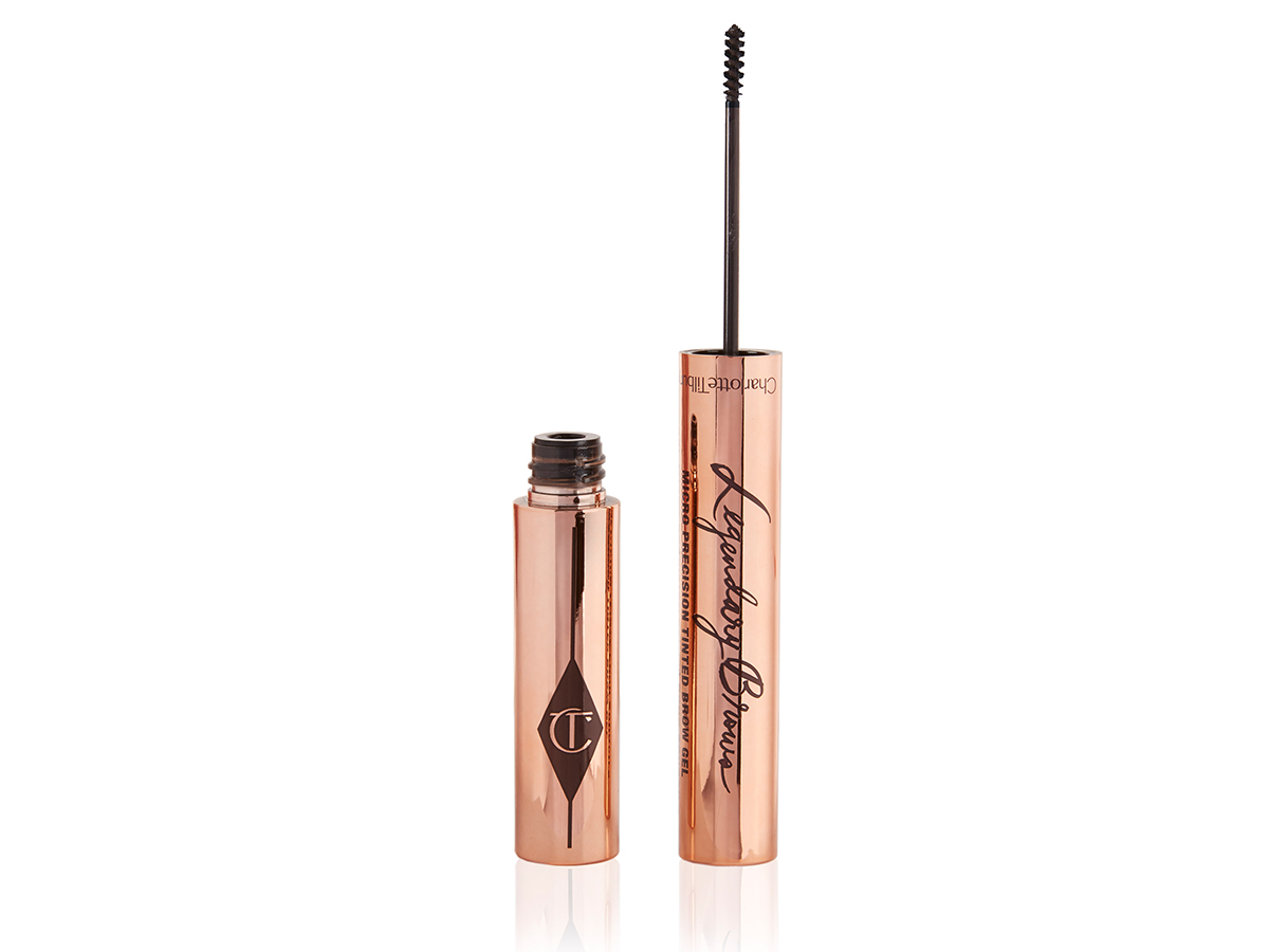 Open brow gel with a thin brush for precision, and a shiny, gold-coloured tube.