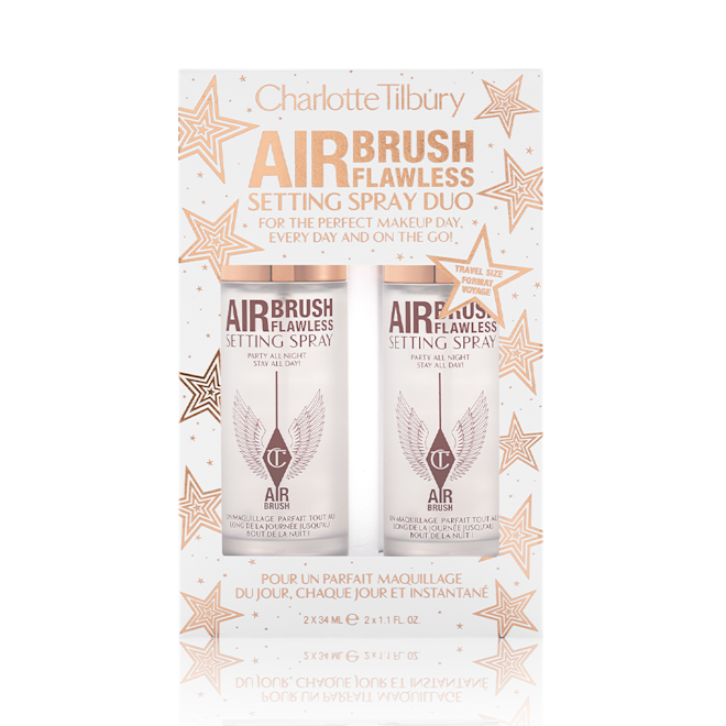 Airbrush Flawless Setting Spray Duo packed Two, identical, mini setting sprays in a white and gold-coloured packaging box with gold stars printed all over with text on the box that reads, 'Charlotte Tilbury. Airbrush Flawless Setting Spray duo'
