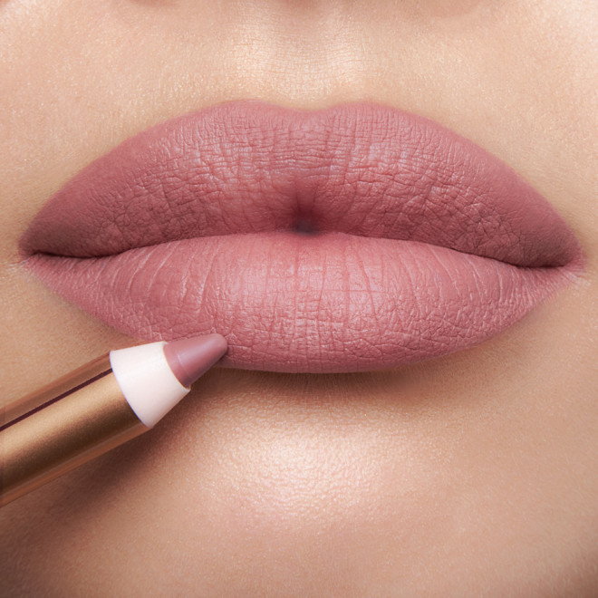 Model wearing Pillow Talk Fair Lip Cheat cool-pink lip liner