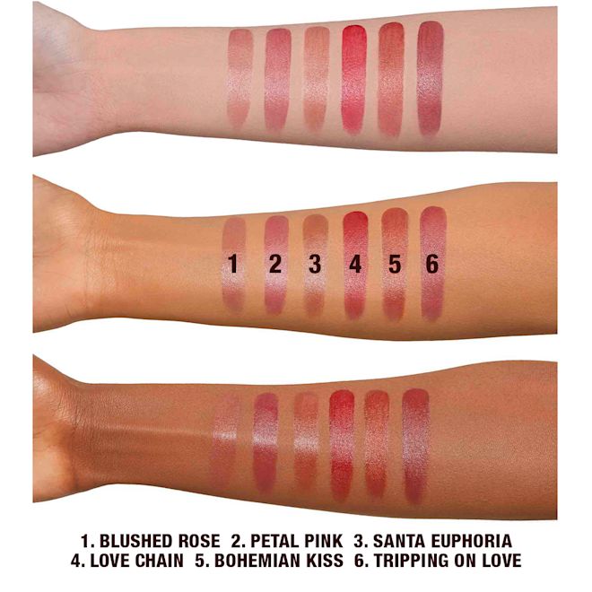 Tinted Love collection arm swatch Swatches of six lip and cheek tints in shades of pink, red, brown, peach and purple on fair, tan, and deep-tone arms.