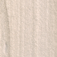 Swatch of a cream highlighter in a subtle grey-gold shade. 