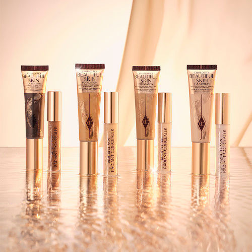 Banner with a collection of foundation tubes with the packaging the colour of the product inside.