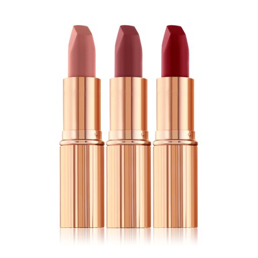 Three open matte lipsticks in nude pink, terracotta, and wine shades