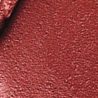 Close-up swatch of a matte lipstick in a soft, muted berry-rose colour. 