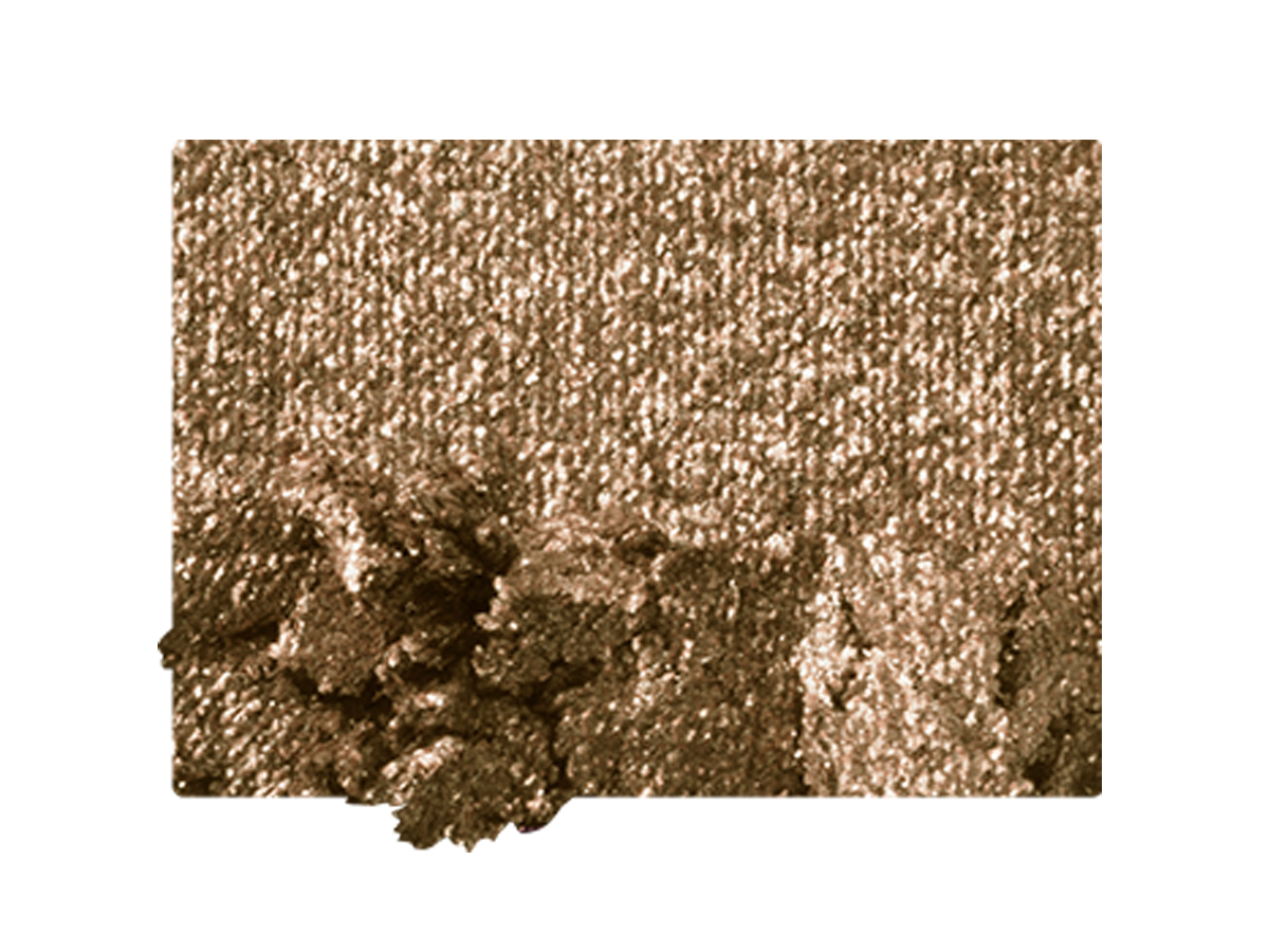 Swatch of a shimmery, powder eyeshadow in a bright golden shade.