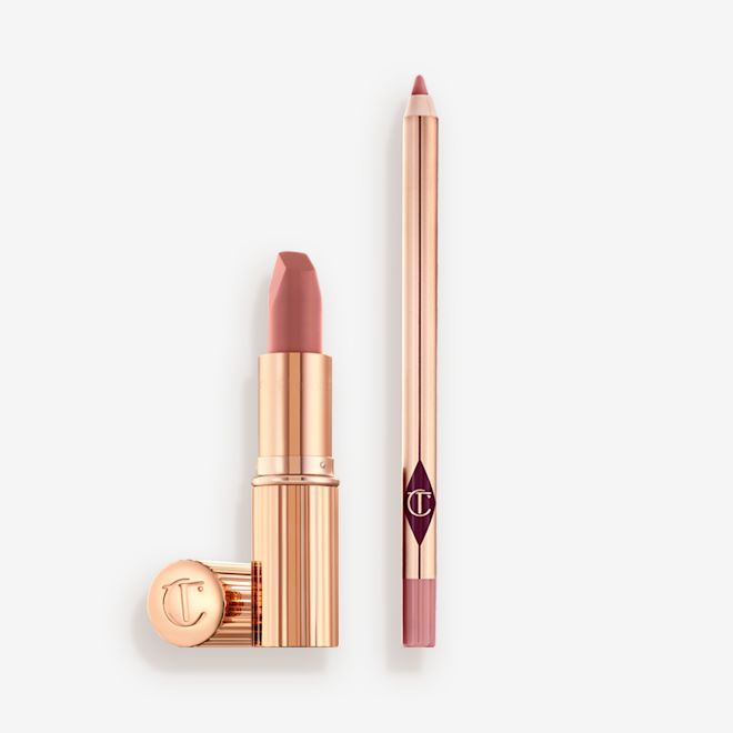 Pillow Talk Lipstick and Lip Liner Kit An open nude pink lipstick in a gold-coloured tube and lip liner pencil in a nude pink shade.