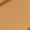 Close-up swatch of a skin-like, glowy foundation in a dark brown beige shade.