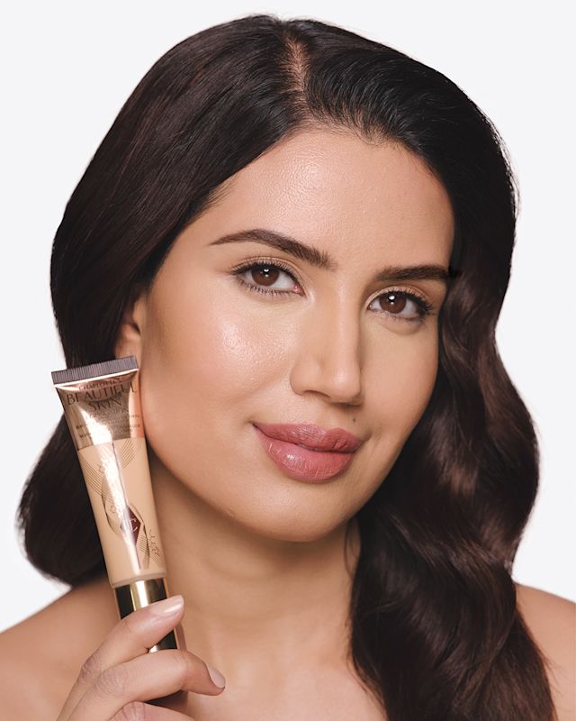 Model wearing Beautiful Skin Foundation with a natural finish
