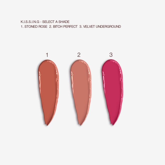 KISSING Lipstick trio swatches Swatches of three satin-finish lipsticks in terracotta, nude peach, and magenta.