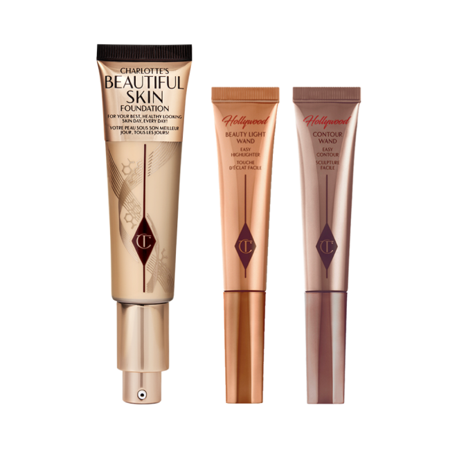 Two, closed liquid contour wands in light brown and chocolate brown next to a foundation wand in gold packaging with a pump dispenser. 