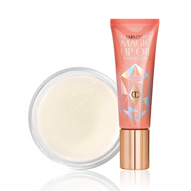 Charlotte's Easy Lip Miracle Duo Lip oil in a coral-coloured tube with a gold-coloured lid with a white-coloured lip scrub in an open glass jar.