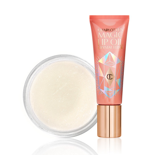 Lip oil in a coral-coloured tube with a gold-coloured lid with a white-coloured lip scrub in an open glass jar. 