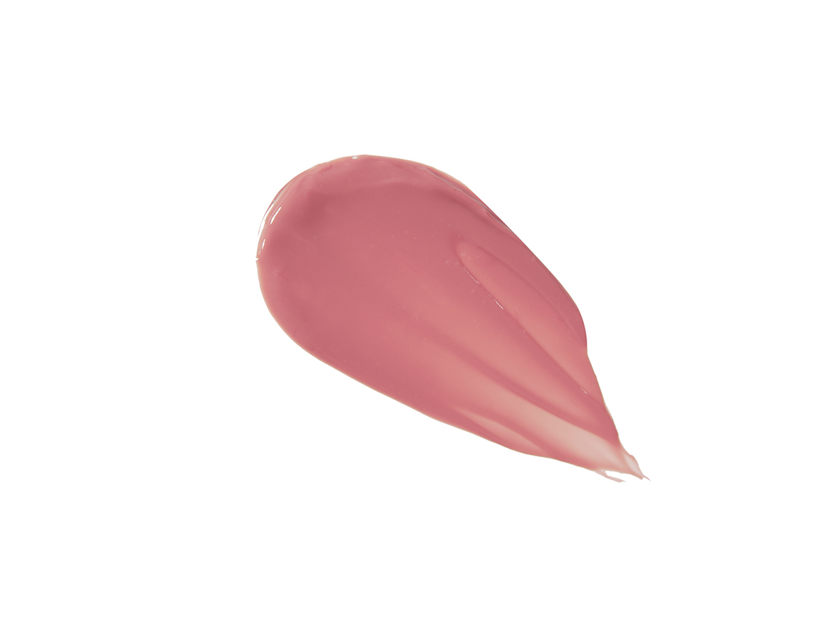 Swatch of a creamy lip and cheek tint in a soft pink shade.