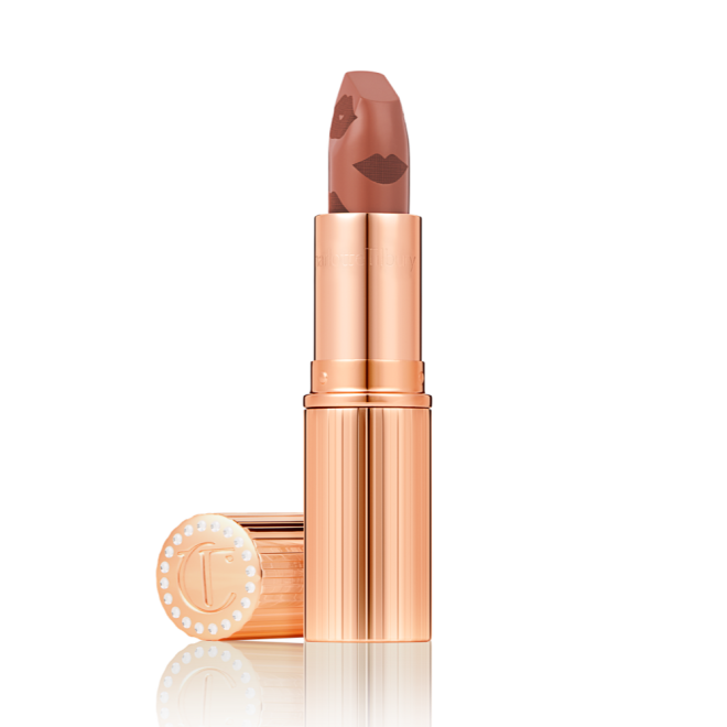  A rosy terracotta coral lipstick with a satin-finish in a gold-coloured tube with its lid next to it.