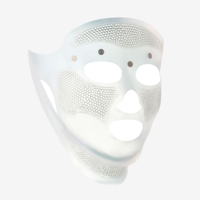 Cryo-Recovery Mask side view displayed A side view of a white-coloured face mask with tiny holes all over the forehead and cheeks area, and large eye, nose, and mouth holes so the mask can comfortably sit on any face size or shape.
