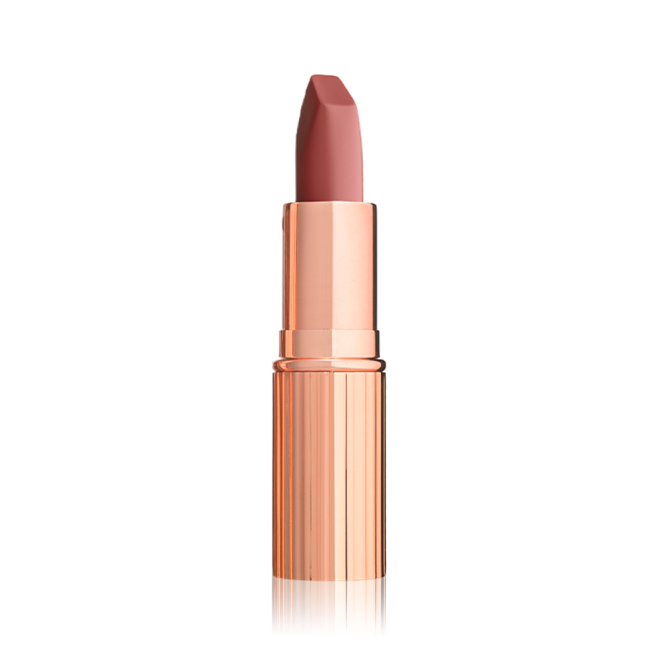 An open matte lipstick in a warm coral rose with a gold-coloured tube.