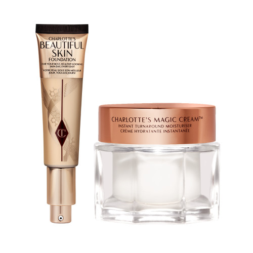 An open foundation tube in sleek gold packaging with a pump dispenser along with pearly-white cream in a glass jar with a gold-coloured lid. 