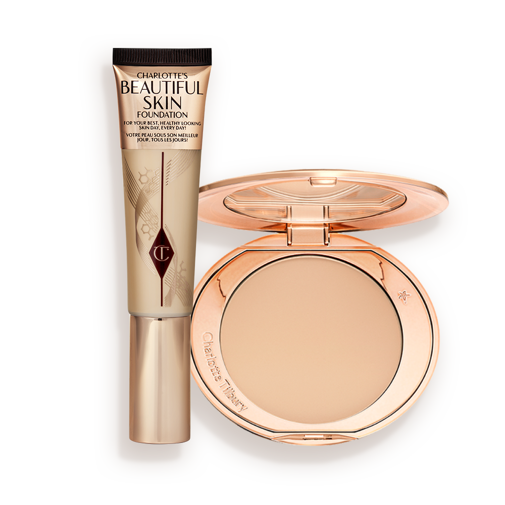 A foundation wand in gold packaging with a brown-beige-coloured body to show the shade of the foundation inside, and a pressed powder compact with a mirrored lid.
