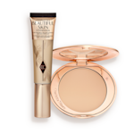 A foundation wand in gold packaging with a brown-beige-coloured body to show the shade of the foundation inside, and a pressed powder compact with a mirrored lid.
