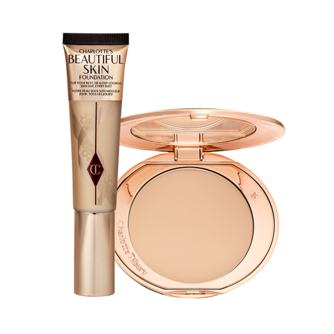 A foundation wand in gold packaging with a brown-beige-coloured body to show the shade of the foundation inside, and a pressed powder compact with a mirrored lid.