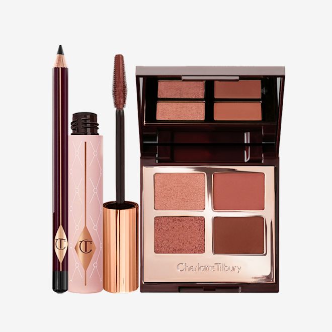 Pillow Talk Eye Enhancing Secrets bundle open A mascara and open eyeshadow palette showing their shade of a berry, dark rosebud colour and black eyeliner