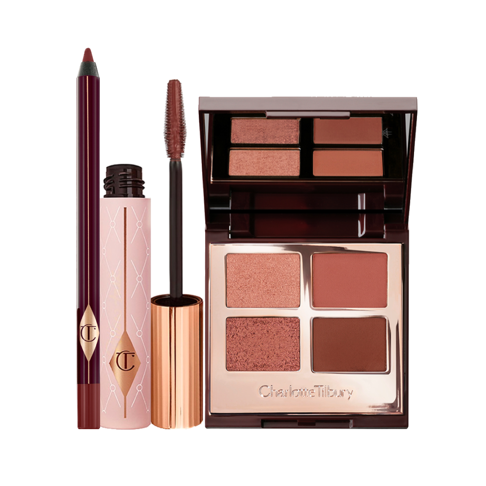 A berry-brown eyeliner, dark brown mascara, and quad eyeshadow palette with a mirrored-lid in shimmery and matte shades of brown and gold. 
