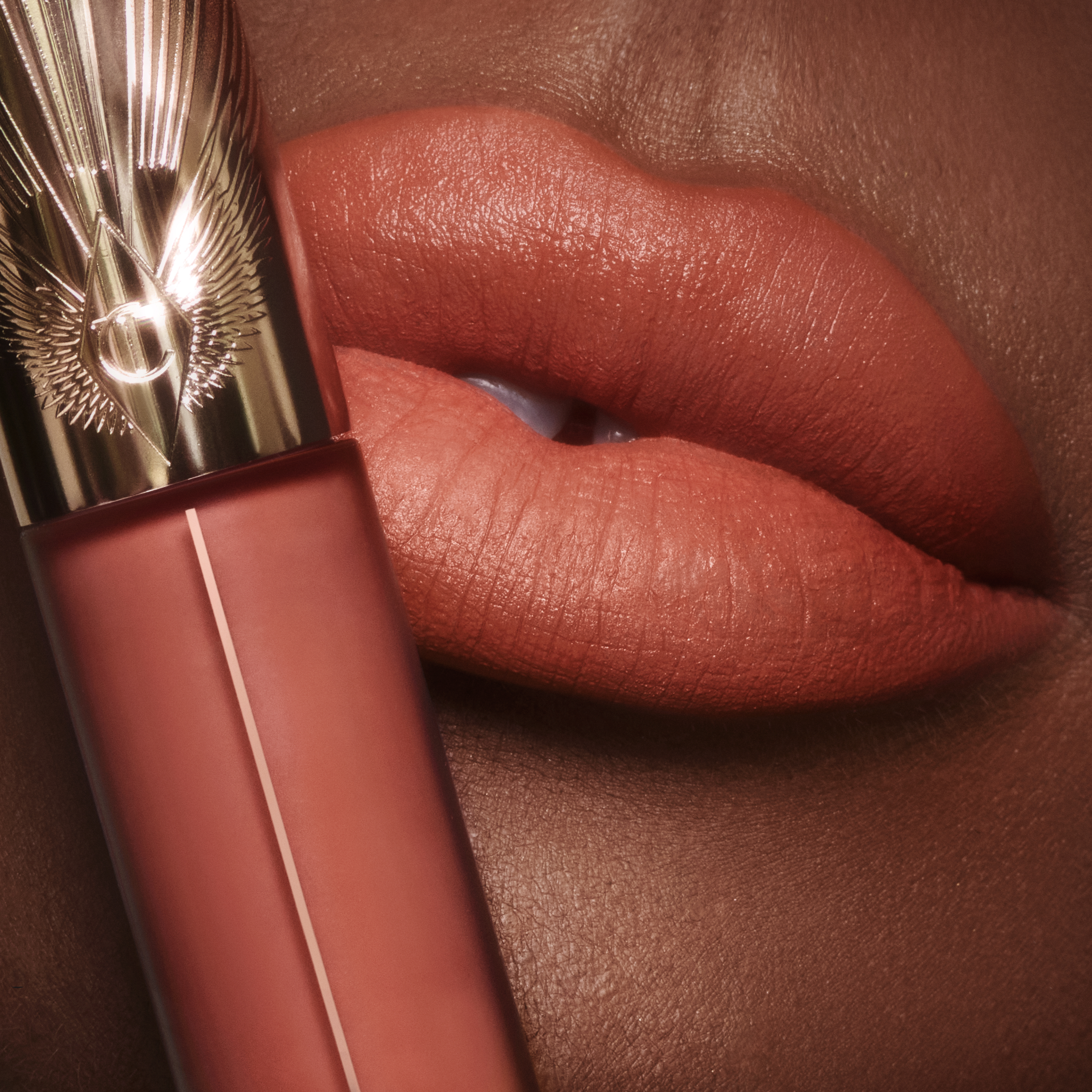 Model wearing Airbrush Flawless Lip Blur in Honey Blur, a warm honey-nude