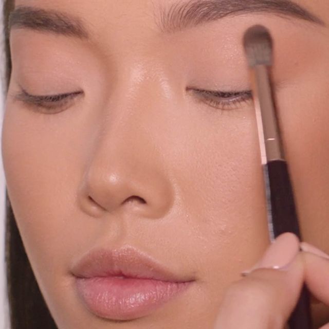 Step 5 in Charlotte's 90s Makeup Look: apply light eyeshadow all over the lid