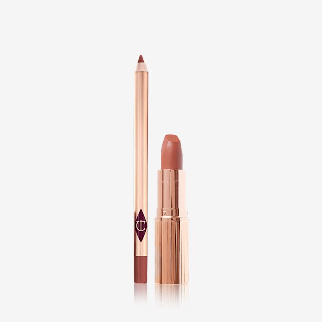 Luscious Lip Slick in Super You open An open lip liner pencil and an open lipstick in a warm, peachy-nude shade.