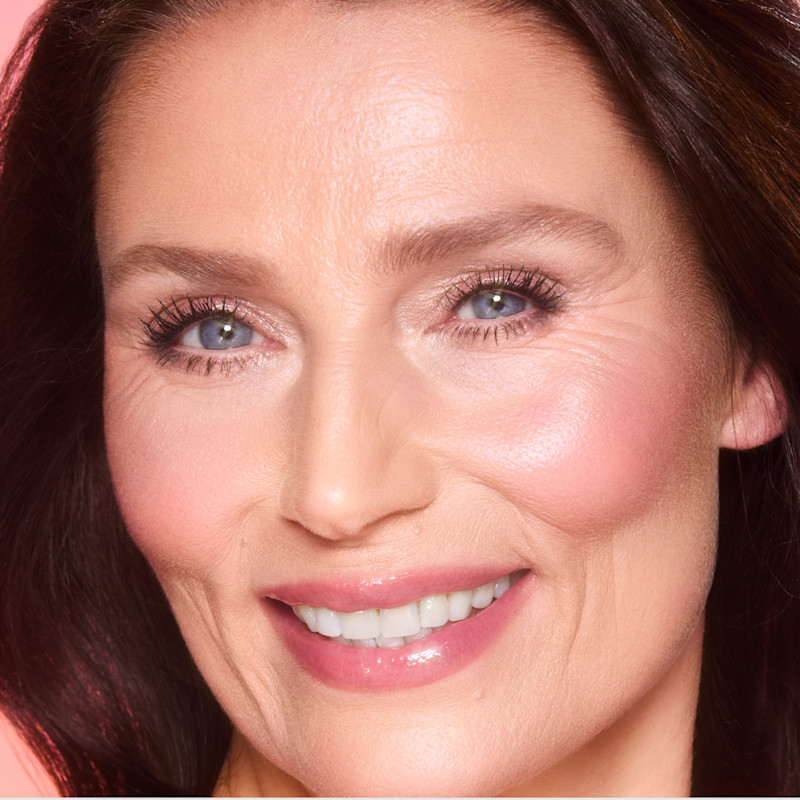 Model wearing Cherry Glow for a red blush look