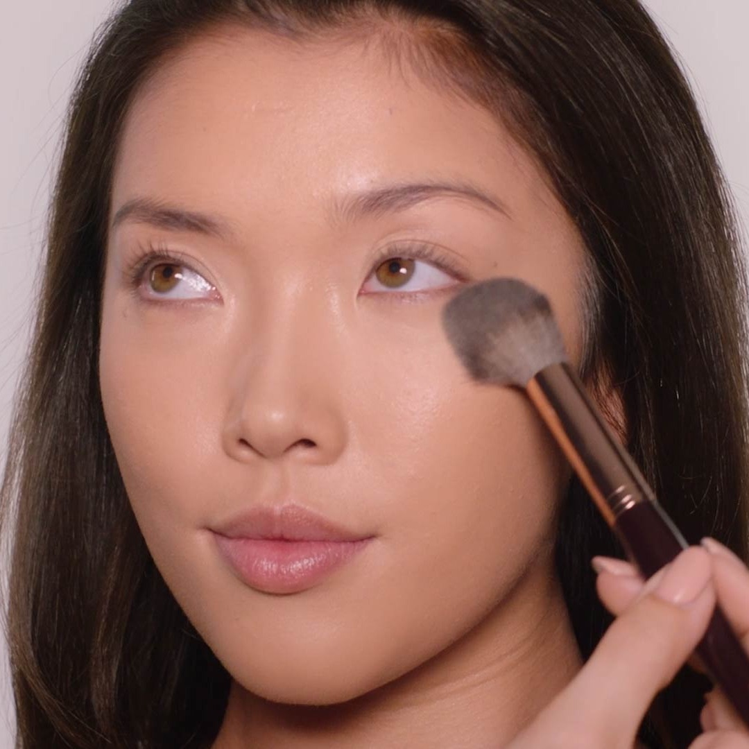 Step 2 in Charlotte's 90s Makeup Look: apply powder