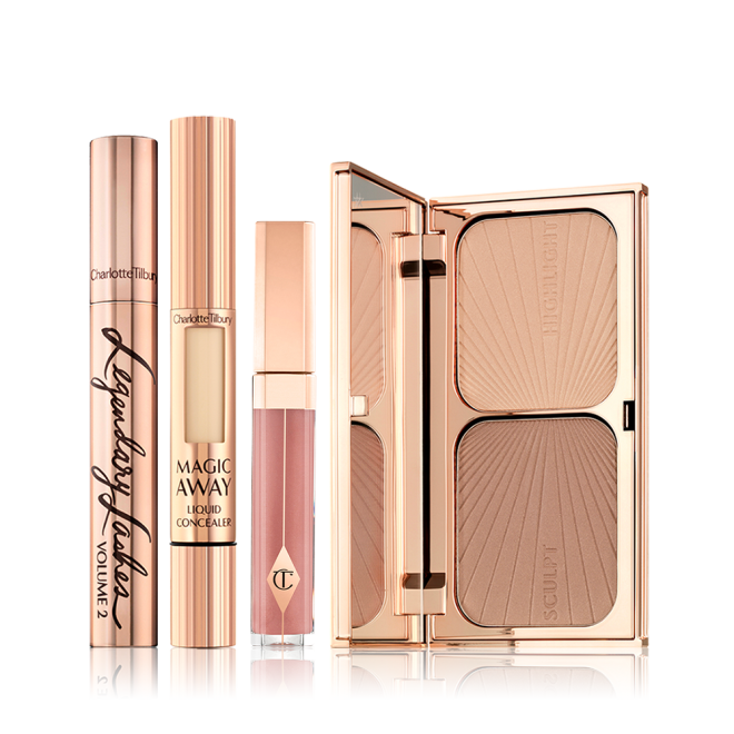 A mascara in a gold-coloured tube with a concealer with a small window on the tube that shows the colour of the concealer inside, nude pink lip gloss, and a duo contour palette with a mirrored-lid. 