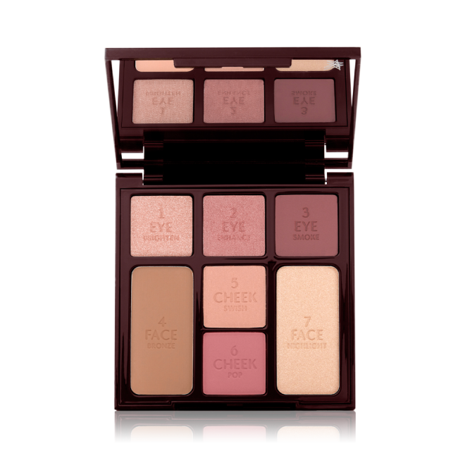 An open, face palette with a mirrored-lid with three rose gold, dusky pink, and plum-coloured eyeshadows, two blushes in soft peach and medium-pink, light brown bronzer, and soft, gold-coloured highlighter.