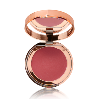 An open, mirrored-lid lip and cheek cream compact in a warm rosebud-pink shade.