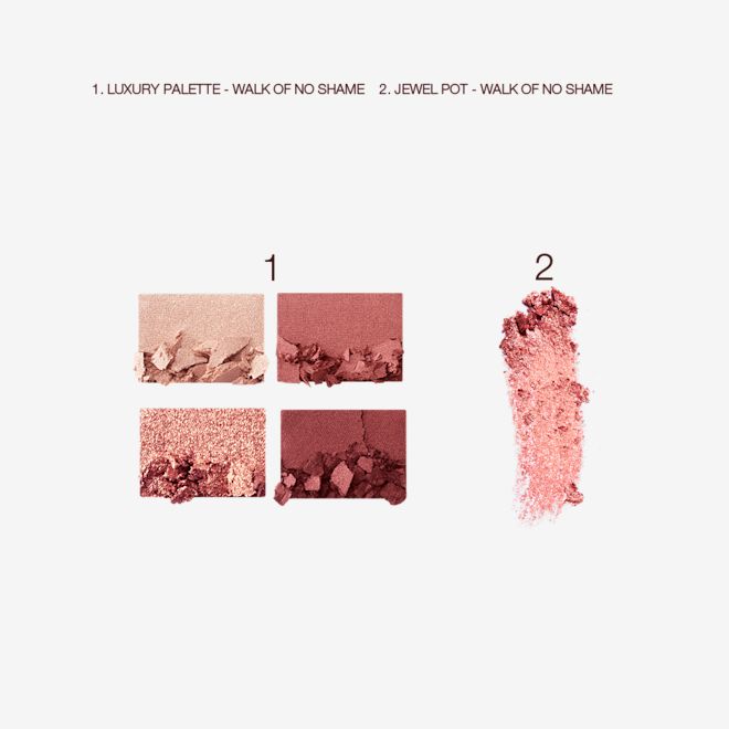 Jewel Eye Kit in Walk of No Shame swatches Swatches of four matte and shimmery eyeshadows in berry-pink, red, and gold shades with a swatch of a berry-pink, shimmery eyeshadow pigment.
